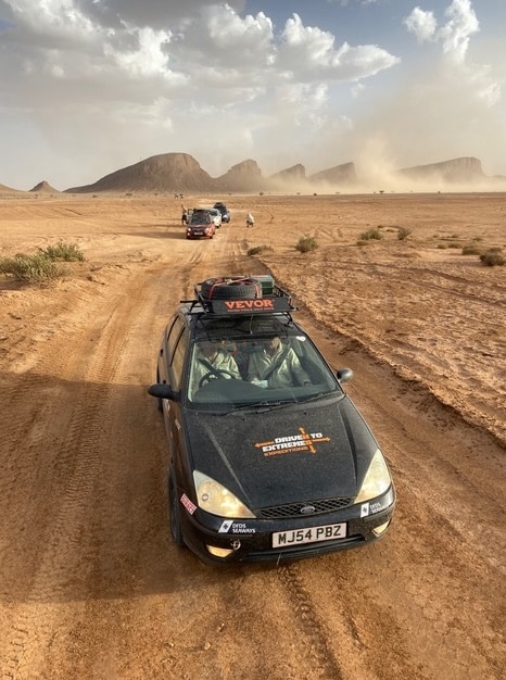 Racing towards the finish line with a sandstorm chasing